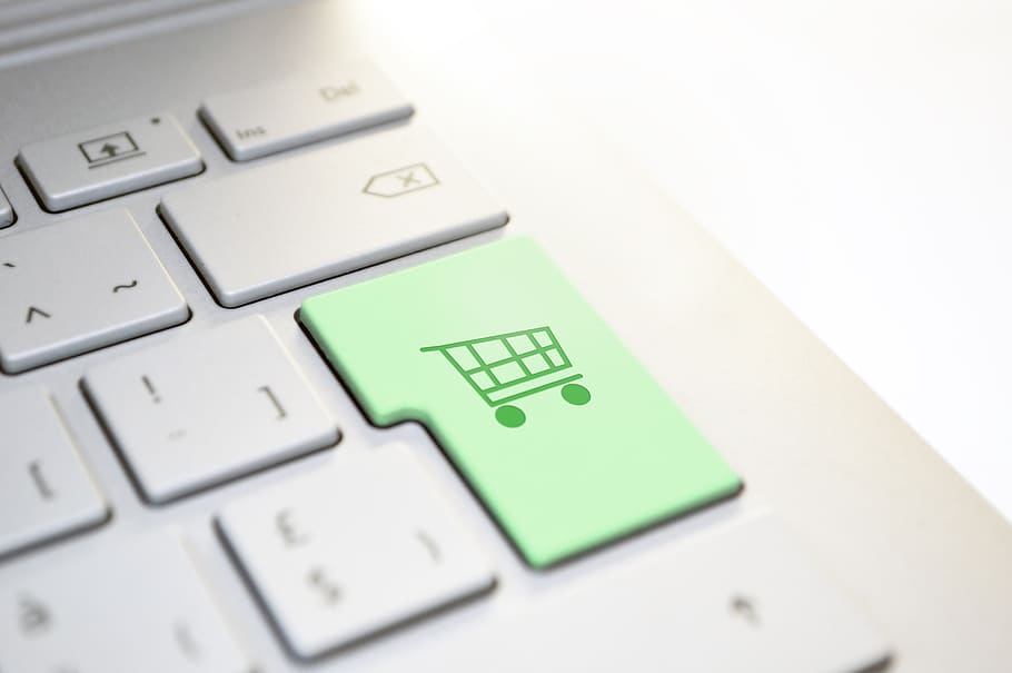 Close-up of a keyboard with a green shopping cart key